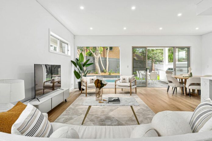 A living room filled with furniture and a flat screen TV