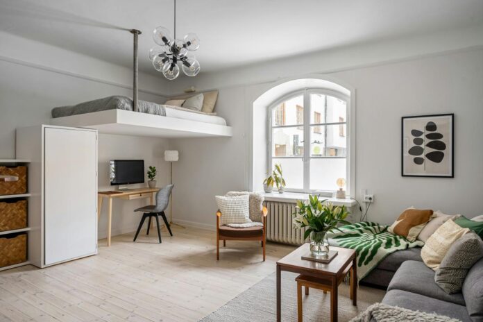 A living room filled with furniture and a large window