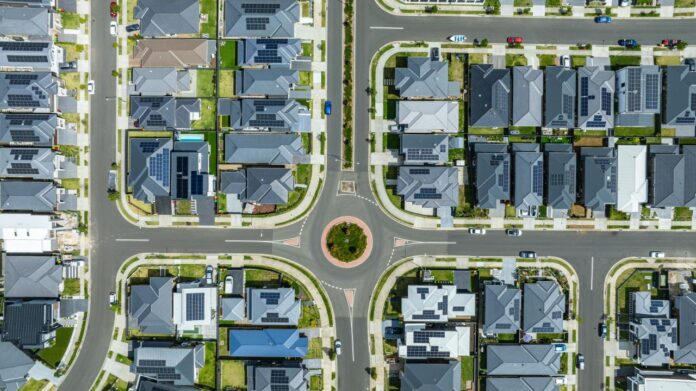 Aerial view of a suburban neighborhood with a roundabout