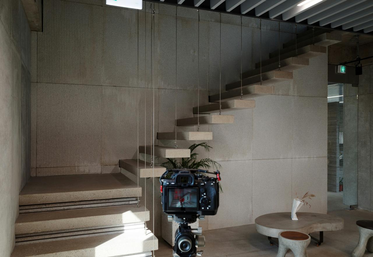 Modern concrete staircase with camera setup